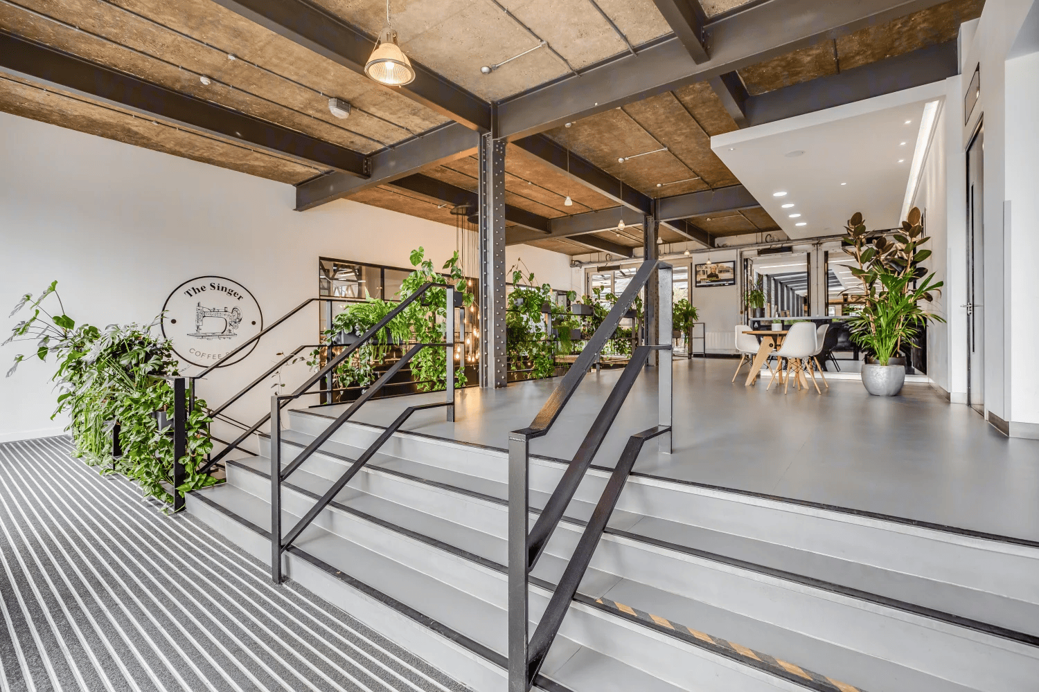Extensive internal planting brings nature indoors throughout.