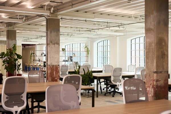 Exposed structural elements are paired with modern finishes