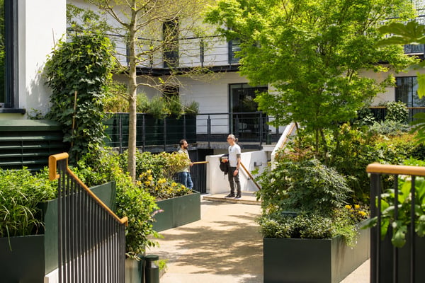 The central courtyard features extensive planting, secure bicycle storage facilities, and serves as an open air throughfare for the building.