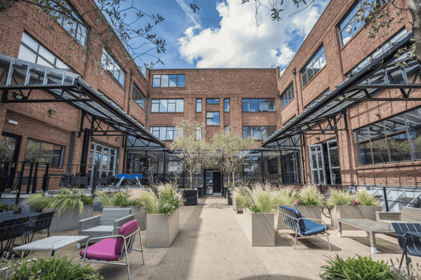 For brighter weather, the building wraps around a communal landscaped courtyard.